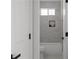 Stylish bathroom with a soaking tub and tiled walls at 115 River Meadow Ln, Social Circle, GA 30025