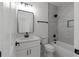 Modern bathroom with a sleek vanity, elegant fixtures, and a combined shower-tub for added functionality at 115 River Meadow Ln, Social Circle, GA 30025