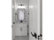 Powder room featuring black hardware, modern rectangular mirror and white vanity at 115 River Meadow Ln, Social Circle, GA 30025