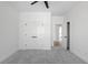 Spacious bedroom has fresh paint, and plush carpet, and features double closets for ample storage at 115 River Meadow Ln, Social Circle, GA 30025