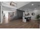 Spacious dining area featuring modern lighting, decor, and an open floor plan with wood floors at 115 River Meadow Ln, Social Circle, GA 30025
