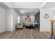 Bright living room with wood floors, modern furnishings, and stylish decor at 115 River Meadow Ln, Social Circle, GA 30025