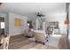 Bright living room featuring neutral paint and decor, and stairs to second floor at 115 River Meadow Ln, Social Circle, GA 30025