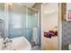 Bathroom featuring a glass shower, patterned wallpaper, and a pedestal sink, offering a vintage aesthetic at 1198 Seminary Dr, Marietta, GA 30064