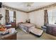 Simple bedroom with carpet, patterned wallpaper border, two windows, and closet at 1198 Seminary Dr, Marietta, GA 30064