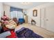 Modest bedroom with carpet, closet, window, and basic furnishings at 1198 Seminary Dr, Marietta, GA 30064