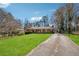 Spacious home with a sprawling green lawn and a long driveway leading to the house at 1198 Seminary Dr, Marietta, GA 30064