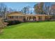 Charming one-story brick home featuring a well-manicured lawn and inviting front porch at 1198 Seminary Dr, Marietta, GA 30064