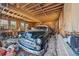 Spacious garage featuring a classic car, wooden walls, and ample storage space at 1198 Seminary Dr, Marietta, GA 30064