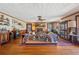 Cozy living room featuring a brick fireplace, hardwood floors, and classic furnishings at 1198 Seminary Dr, Marietta, GA 30064