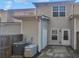 Rear exterior featuring a patio and two AC condensers at 474 Berckman Nw Dr, Lilburn, GA 30047