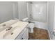 Clean bathroom with a white vanity, neutral countertops, and tiled flooring at 474 Berckman Nw Dr, Lilburn, GA 30047