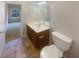 Bright bathroom with a vanity and toilet at 474 Berckman Nw Dr, Lilburn, GA 30047