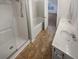 Bathroom featuring tiled floor, tub, shower, and a double sink vanity at 474 Berckman Nw Dr, Lilburn, GA 30047