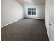 Bright and airy bedroom featuring plush carpeting and ample natural light at 474 Berckman Nw Dr, Lilburn, GA 30047