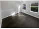 Bright dining room with sleek hardwood floors and contemporary lighting fixture at 474 Berckman Nw Dr, Lilburn, GA 30047