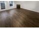 Spacious living room featuring a door to the outside and a fireplace at 474 Berckman Nw Dr, Lilburn, GA 30047