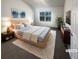 Cozy bedroom with large window, soft carpet, and comfortable furnishings at 474 Berckman Nw Dr, Lilburn, GA 30047