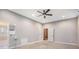 Unfinished basement featuring utility connections, painted walls, and ceiling fan at 8955 Shalford Ct, Cumming, GA 30041