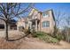 Brick house featuring a front yard with trees and landscaping, offering suburban charm at 8955 Shalford Ct, Cumming, GA 30041