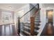 Spacious foyer with hardwood floors, staircase, and elegant details, offering a welcoming entrance at 8955 Shalford Ct, Cumming, GA 30041