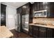 Spacious kitchen with stainless steel refrigerator, double oven, and gas cooktop at 8955 Shalford Ct, Cumming, GA 30041