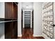 Large walk-in closet with custom shelving and hardwood floors for organized storage at 8955 Shalford Ct, Cumming, GA 30041