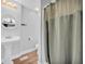Freshly renovated bathroom with a pedestal sink and a shower with modern fixtures at 3351 Phillip Cir, Decatur, GA 30032