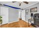 Cozy bedroom featuring hardwood floors, ceiling fan, and neutral gray walls at 3351 Phillip Cir, Decatur, GA 30032