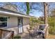 Relaxing deck featuring an outdoor dining set and a peaceful view of the backyard at 3351 Phillip Cir, Decatur, GA 30032