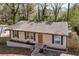 Well-kept exterior featuring a classic design, complemented by a tidy yard and mature trees at 3351 Phillip Cir, Decatur, GA 30032