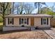 Charming single-story home featuring a well-maintained yard and classic architectural details at 3351 Phillip Cir, Decatur, GA 30032