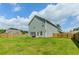 Large backyard featuring a fenced in yard and a grassy lawn at 3391 Meadow Grass Dr, Dacula, GA 30019
