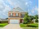 Charming two-story brick home featuring a two-car garage and a well-manicured front lawn at 3391 Meadow Grass Dr, Dacula, GA 30019