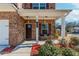 Inviting front porch with bench seating and charming details, enhancing curb appeal at 3391 Meadow Grass Dr, Dacula, GA 30019