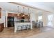 Modern kitchen with granite countertops, stainless steel appliances, and a center island at 3391 Meadow Grass Dr, Dacula, GA 30019
