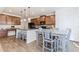 Spacious eat-in kitchen with granite counters, wooden cabinets, and gray table at 3391 Meadow Grass Dr, Dacula, GA 30019