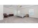 Spacious primary bedroom featuring tray ceilings and lots of natural light at 3391 Meadow Grass Dr, Dacula, GA 30019