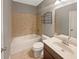 Full bathroom with tub-shower combo, single vanity, and tiled surround at 4913 Sydney Ln, Marietta, GA 30066
