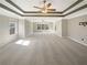 Expansive bedroom with tray ceilings, multiple windows, and ample space for furnishings at 4913 Sydney Ln, Marietta, GA 30066