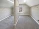 Carpeted walk-in closet with built-in shelving and a window for natural light at 4913 Sydney Ln, Marietta, GA 30066