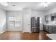 Bright kitchen area showcasing stainless steel appliances, hardwood floors, and generous natural light at 1579 Eastern Sunrise Ln, Decatur, GA 30034