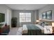 Serene main bedroom featuring a plush bed, a large window, neutral décor, and stylish furnishings at 1579 Eastern Sunrise Ln, Decatur, GA 30034