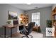 Functional home office with a sleek desk, comfortable chair, ample storage, and natural light at 1579 Eastern Sunrise Ln, Decatur, GA 30034
