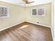 Bedroom featuring two windows, and warm colored floors at 7648 Mount Zion Blvd, Jonesboro, GA 30236