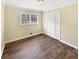Bedroom with a large window and light colored floors at 7648 Mount Zion Blvd, Jonesboro, GA 30236