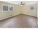 Bright bedroom with light gray floors, neutral wall colors and two large windows at 7648 Mount Zion Blvd, Jonesboro, GA 30236