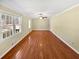Bright living room with hardwood floors, neutral wall colors and large windows at 7648 Mount Zion Blvd, Jonesboro, GA 30236