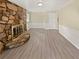 Bright living room featuring a stone fireplace and neutral color scheme at 7648 Mount Zion Blvd, Jonesboro, GA 30236