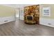 Living room with a stone fireplace and light gray floors at 7648 Mount Zion Blvd, Jonesboro, GA 30236